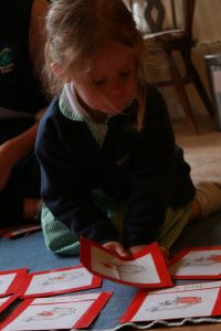 A pre school child works with the montessorui materials in the pre school